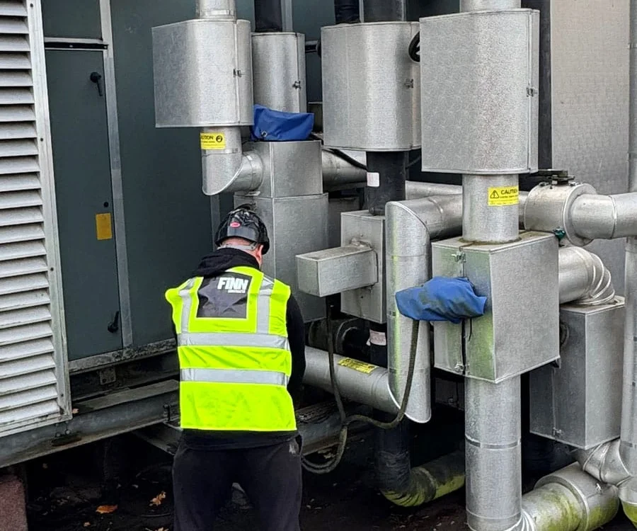 Finn Contracts operative at work on building services